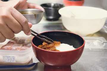 People cooking tuna maguro sushi and rice