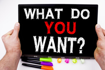 What Do You Want text written on tablet, computer in the office with marker, pen, stationery. Business concept for Asking Opportunity Development Questions white background with space