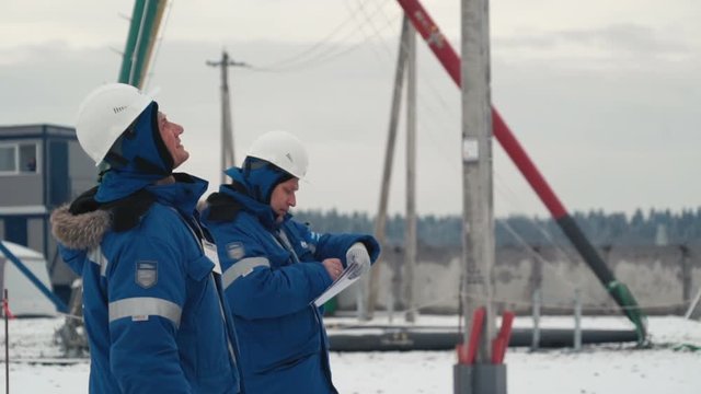 Two men are working close up