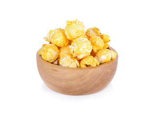 popcorn with butter flavors on wooden bowl with white background