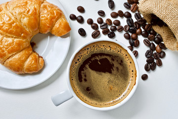 Coffee cup and croissant breakfast 