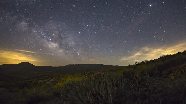 Time lapse of Milky Way and then sunrise over wildflowers in the Anza-Borrego Desert