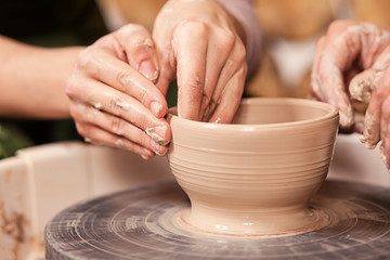 Fototapeta na wymiar woman potter teaches