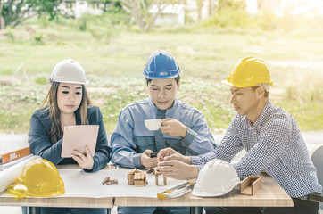 Group of Professional engineer are discussing the project building plan with his business client