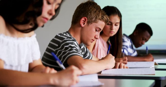 Schoolkids studying in classroom 
