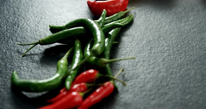 Various chili pepper on black background 
