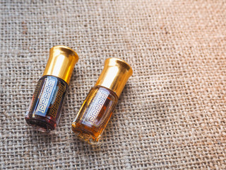 Arabian oud attar perfume or agarwood oil fragrances in mini bottle.
