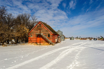 red wooden shed on the farmer yard