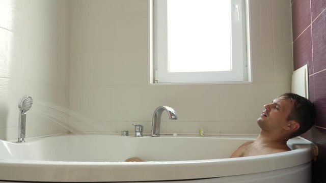 man taking a bath. 4k, slow motion