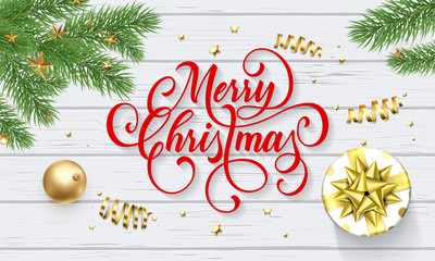 Merry Christmas greeting card of New Year gift and golden decoration ball on white wood background. Vector design template and Christmas calligraphy wish text for winter season holiday
