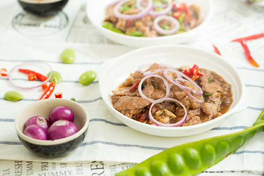 Stir Fried Pork with Shrimp Paste and bitter bean, Thai Food isolated on white background