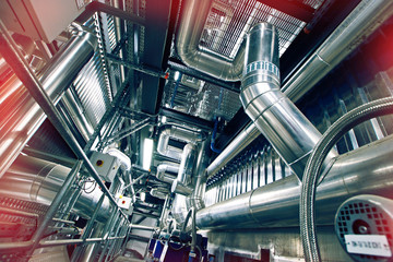 Fototapeta premium Equipment, cables and piping as found inside of a modern industrial power plant
