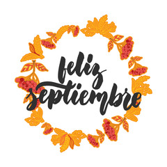 Feliz septiembre - happy september in spanish, hand drawn latin autumn month lettering quote with seasonal wreath isolated on the white background. Fun brush inscription for greeting card or posters. © tumana_net