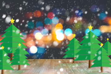 Empty wood table with snowfall and christmas tree  - Abstract Christmas background. For holiday and new year concept.