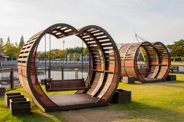 Heart bench swings in the park.