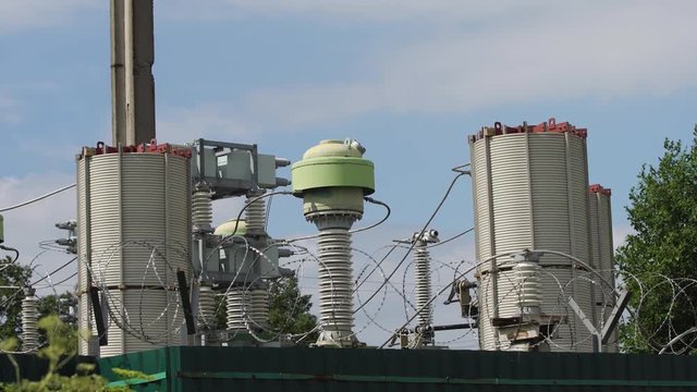 Aerial view Power plant, transformation station, cables and wires. Electrical power transformer in high voltage substation. High voltage electric power substation. 4K
