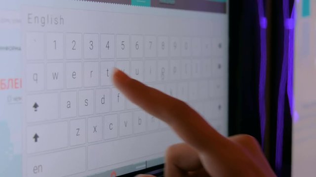Woman using interactive touchscreen display at modern technology show