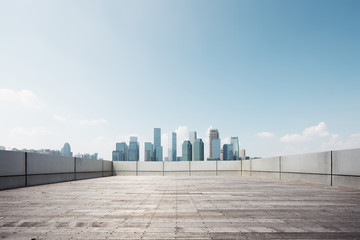 Fototapeta premium empty brick floor with modern cityscape