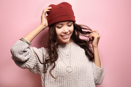 Beautiful hipster girl on pink background