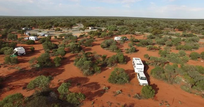 Aerial views of Grey Nomads free camping with cars and caravans at Nerren Nerren Station between Geraldton and Carnarvon in Western Australia 