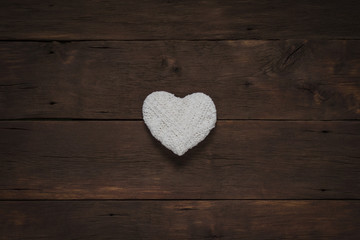 White heart on a wooden background