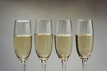 Composition of four glasses with champagne