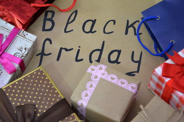 Black Friday handwritten. sales concept. shopping. boxes with gifts. shopping bags