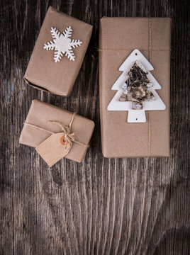 Handmade gift boxes decorated with Vhristmas tree, snowflake and tag for text