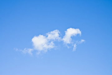 Blue sky background with white clouds - image with copy space