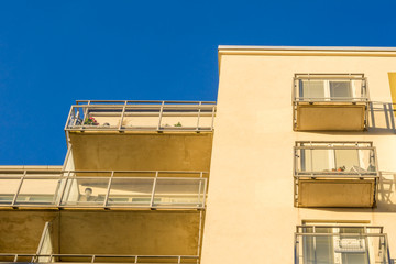 Fototapeta na wymiar Modern Luxury Apartment Building Blue Sky Facade Home Residential Structure Balcony