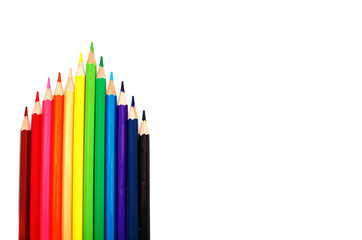 Multicolored pencils on white background