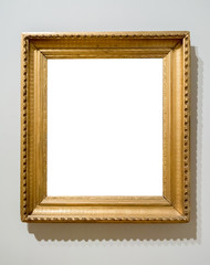 Gilded Vintage Ornate Picture Frame Art Gallery Museum White Clipping Path Isolated Template White Wall Natural Shadows. For paintings, mirrors and photos.