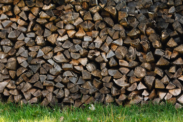 ends of logs wooden background. toning. wood in the stack.