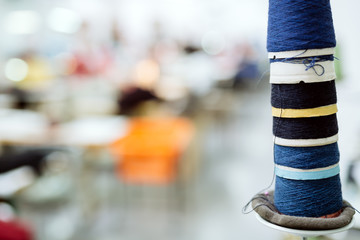 Wool and thread spools on desk