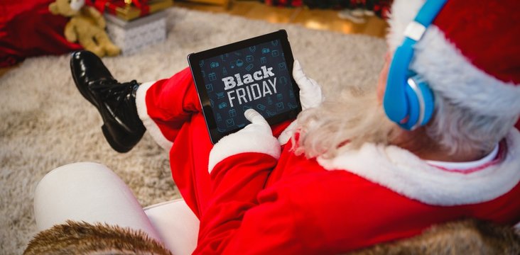 Composite image of black friday text with christmas icons on