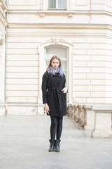 Beautiful young woman posing in the autumn wear