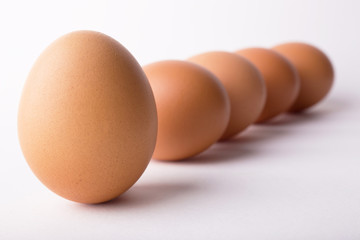 Five eggs are isolated on a white background
