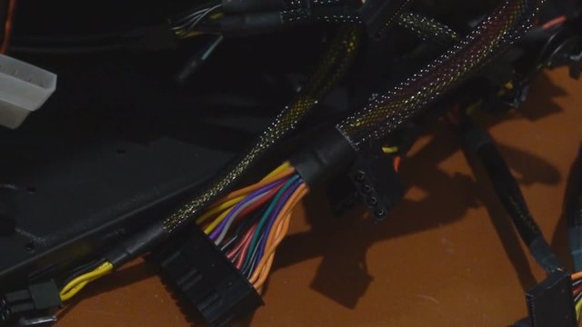 the system unit of the stationary computer is dismantled. A broken computer with wires. damaged hackor virus server. 4k