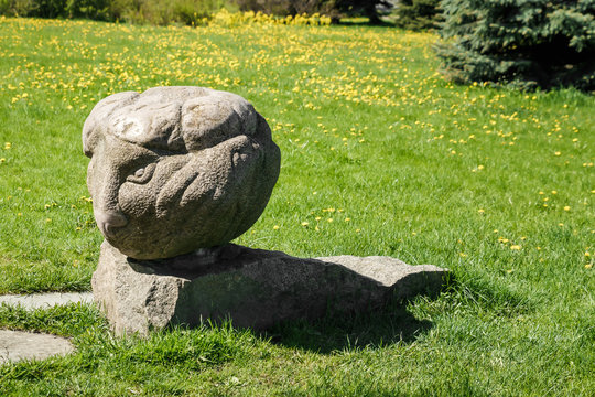 Stone sculptures on a green lawn