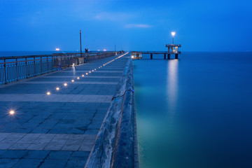 Before sunrise in Burgas bay. Bridge in Burgas, Bulgaria. Long exposure, blue hour. Kay port
