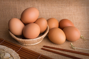 Set Eggs in a basket on  gunny (sackcloth)  background
