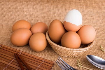 Set Eggs in a basket on  gunny (sackcloth)  background