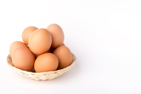 Eggs in rattan basket a healthy food gift on white backgrounds