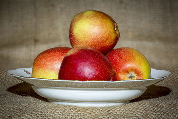 Apples on fruit plate with background