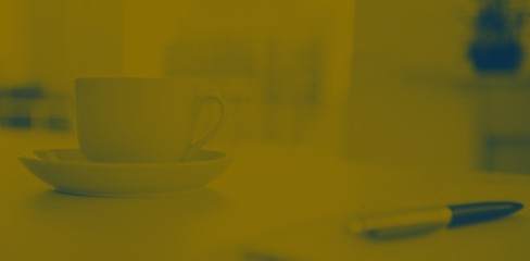 A cup of coffee which is posing on the table