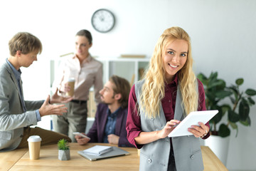 Team leader holding tablet