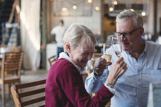 Senior Couple Toasting With Champagne