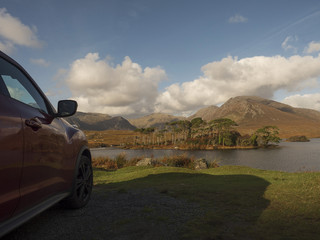 Car park off road, with beautiful view on Connemara National Park an Derryclare Lough