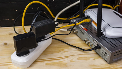 Chargers, electrical cables in the socket concept Electricity