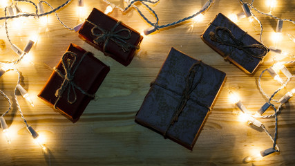 New Year's gifts on the background of festive bright lights concept of the New Year holiday